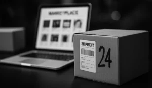 A black and white photograph of a clean, modern workspace with a laptop displaying an online marketplace dashboard, surrounded by shipping boxes and packing supplies, symbolizing multi-channel ecommerce fulfillment.